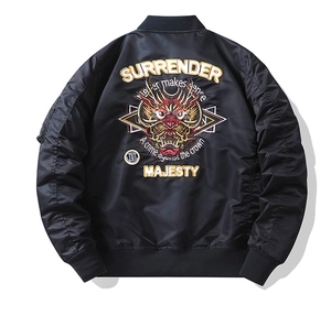 Detailed back view of a black MA-1 bomber jacket featuring intricate dragon embroidery
