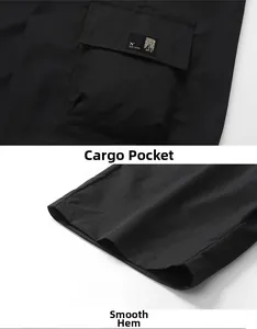 Detail of black cargo shorts featuring large utility pocket with woven label and hem stitching
