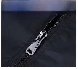 Detail of high-quality metal zipper on a black bomber jacket with a smooth alloy slider