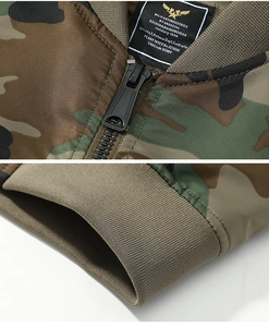 Close-up of camouflage flight jacket featuring metal zipper and ribbed knit cuffs