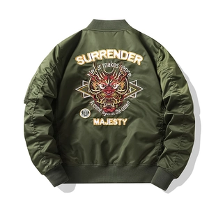 Detailed view of heavy embroidery dragon head design on olive green MA1 flight jacket back