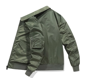 Detail view of olive green bomber jacket featuring a utility zipper pocket on the sleeve