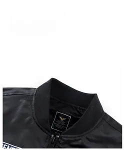 Macro detail of MA-1 bomber jacket knit collar, metal zipper, and brand neck label