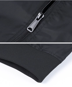Close-up of metal zipper and ribbed cuffs on black MA1 pilot flight jacket