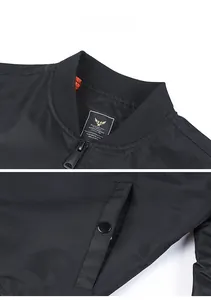 Macro view of black bomber jacket ribbed collar with inner brand label and zipper