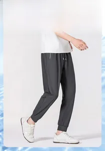 Detail view of quick-dry ice silk pants featuring elastic drawstring waist and deep grey color