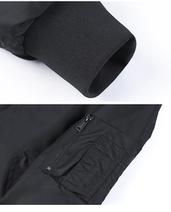 Detail of MA-1 pilot jacket showing ribbed cuffs and utility metal zipper sleeve pocket