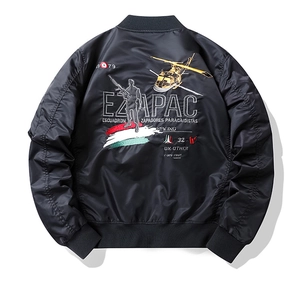 Detailed military embroidery on the back of a black satin nylon MA1 bomber jacket