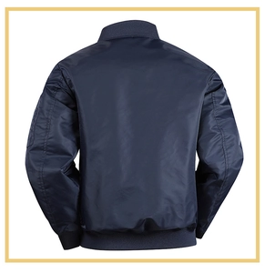 Detail view of the ribbed cuffs and sleeve zipper pocket on a dark blue bomber jacket