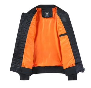 Detail of pilot jacket showing black windproof exterior and bright orange satin lining