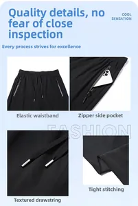 Detail view of elastic waist, drawstring and zipper pockets on men's ice silk pants