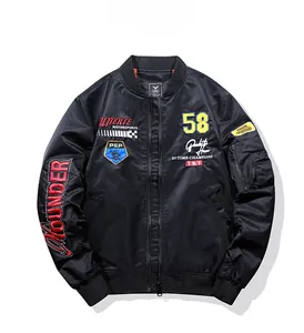 Detail of MA-1 bomber jacket with racing embroidery, patches, and zip sleeve pocket