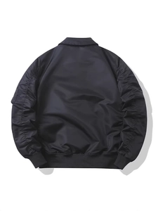 Classic black pilot bomber jacket with ribbed cuffs and sleeve pleats on white background