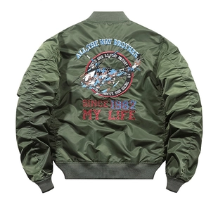 Detailed helicopter embroidery on the back of a green military flight bomber jacket