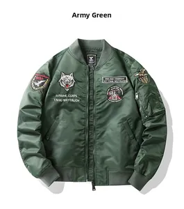 Detail of army green bomber jacket featuring military patches and wolf embroidery