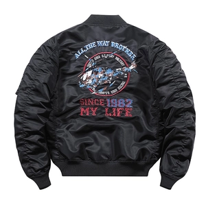 Detailed embroidery of military helicopter and text on black pilot bomber jacket back