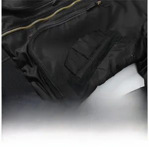 Detail view of MA1 bomber jacket featuring golden zippers and functional oblique pockets