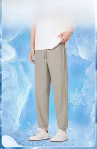 Detail of men's beige ice silk pants showing the drawstring waist and cooling fabric