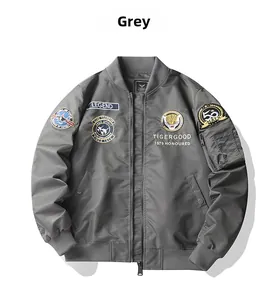 Detailed view of vintage grey bomber jacket featuring tiger embroidery and utility pocket