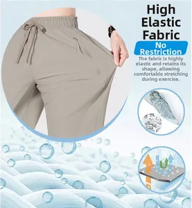 Detailed view of elastic khaki ice silk pants showing stretch fabric and breathable texture