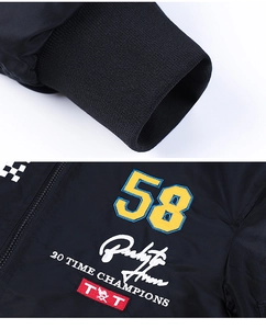 Detail of ribbed cuffs and embroidered champion patches on black MA1 pilot jacket