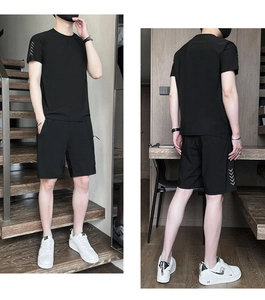 Detail view showing breathable fabric and V-shaped patterns on men's sports set