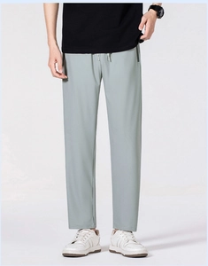 Detail view of men's quick-dry pants featuring an elastic drawstring waist and zipper pocket