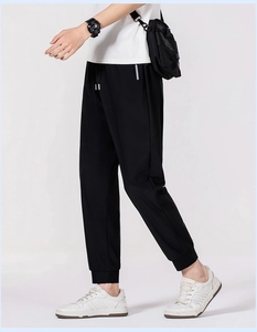 Detail of men's quick-dry ice silk pants featuring drawstring waist and side stripes