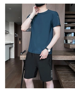 Detail of dark blue quick-dry sports t-shirt and black shorts with white dot patterns