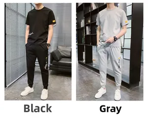 Set sportivo estivo in seta di ghiaccio con magliette nere e grigie e pantaloni sportivi