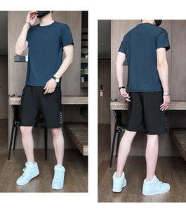 Modern two-piece sports set for men with dark blue t-shirt and black shorts detail