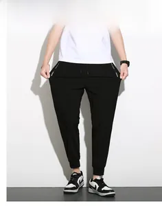 Detail showing high elasticity fabric and side pocket design on men's black joggers