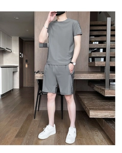 Detail showing high-breathability grey quick-dry fabric on men's summer sports set