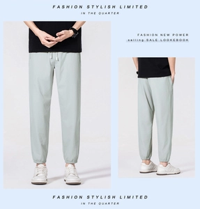 Men's light green ice silk pants featuring elastic cuffs and drawstring waist detail
