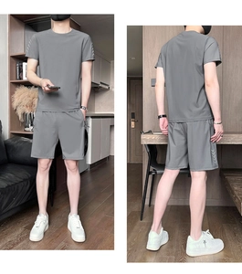 Men's grey sports set showing front and back views with white V-pattern side details
