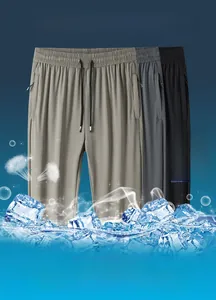 Close-up of lightweight ice silk pants in grey and black with elastic drawstring waist