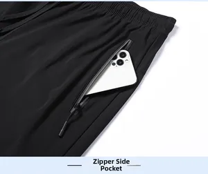 Detail shot of the secure zippered side pocket on quick-dry black breathable sports pants
