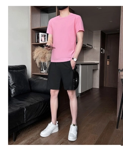 Detail of pink men's sports t-shirt and black shorts with functional zipper pockets