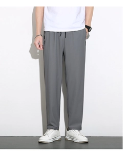 Detail of men's dark grey ice silk sports pants featuring elastic waist and zipper pockets