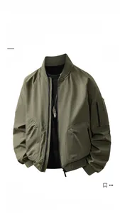 Detail of olive green bomber jacket featuring ribbed collar and functional sleeve zipper pocket