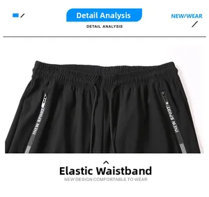 Detail of men's quick-dry pants featuring elastic drawstring waist and zipper pockets