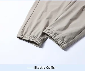 Detail of elastic cuffs on men ice silk pants with smooth stitching for a sporty look
