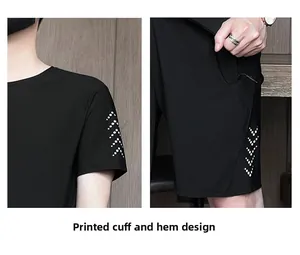 Detail of white arrow print design on cuffs and hems of the black quick-dry sportswear set