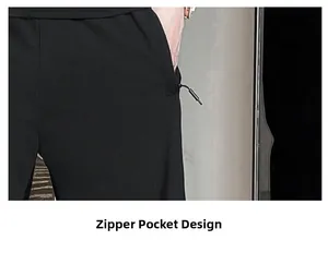 Detail shot of black sports pants featuring secure side zipper pockets with long pulls