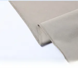 Detail of greyish-brown cooling ice silk fabric featuring high-density overlock stitching