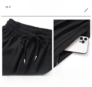 Detail of breathable quick-dry ice silk sports pants featuring secure zip pockets
