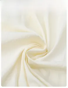 Close-up of white ice silk fabric showing breathable knit texture and smooth drape