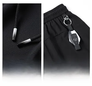 Detail of men's quick-dry pants featuring grid texture fabric and gradient drawstring