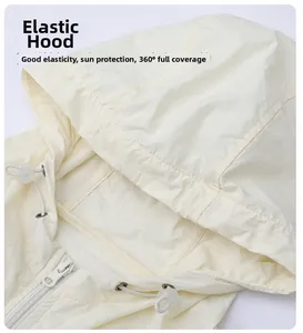 Close-up of cream white sun protection hoodie featuring elastic hood and drawstrings