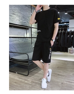 Detail of men's black ice silk sports set featuring side stripes and printed logo text